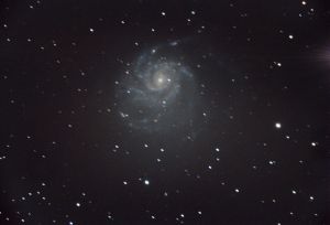 The Pinwheel Galaxy (also known as Messier 101, M101 or NGC 5457) is a face-on spiral galaxy 21 million light-years (6.4 megaparsecs)[5] away from Earth in the constellation Ursa Major. It was discovered by Pierre Méchain in 1781[a] and was communicated that year to Charles Messier, who verified its position for inclusion in the Messier Catalogue as one of its final entries.